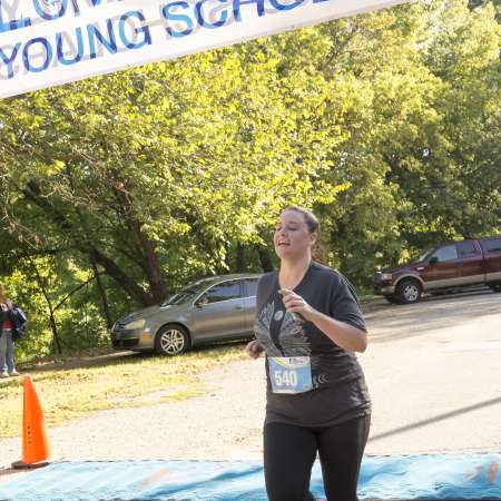 Runners cross the finish line.