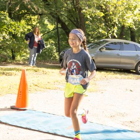 Runners cross the finish line.