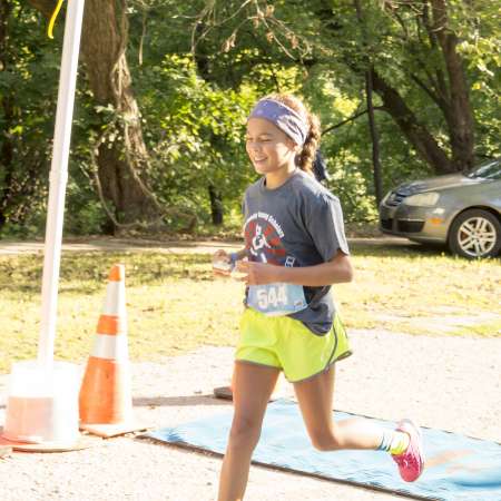 Runners cross the finish line.