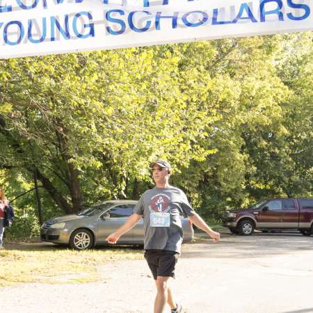 Runners cross the finish line.