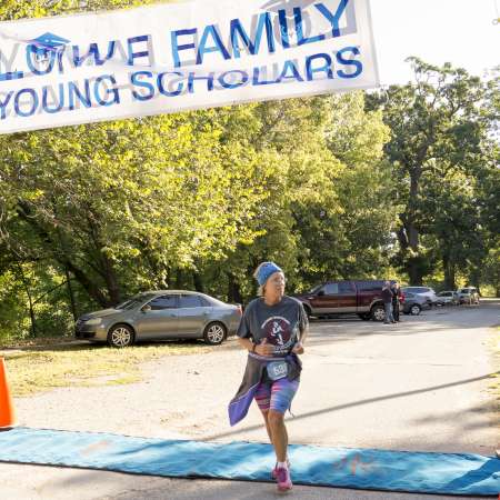 Runners cross the finish line.