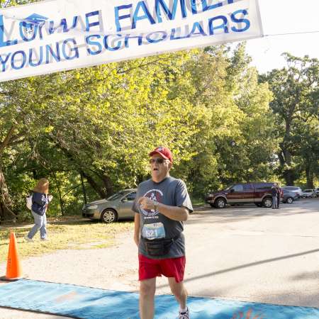 Runners cross the finish line.