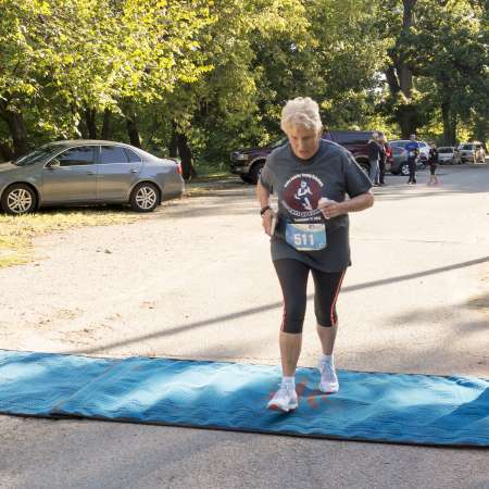 Runners cross the finish line.