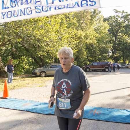 Runners cross the finish line.