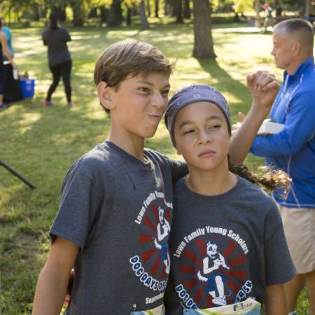 Runners pose while waiting for the remaining runners to cross the finish line.