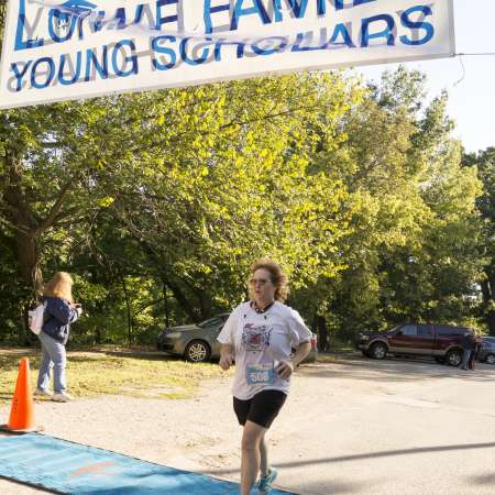 Runners cross the finish line.