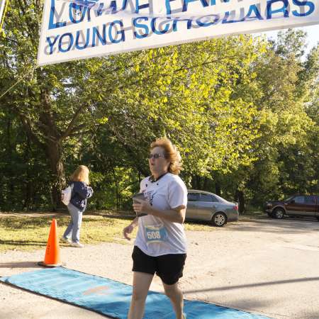 Runners cross the finish line.