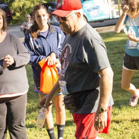 Runners listen to announcements.