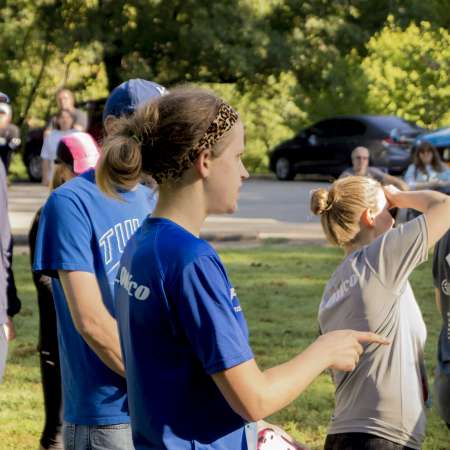 Runners listen to awards.