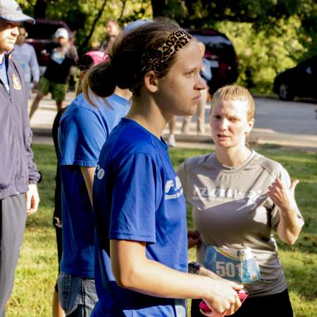 Runners listen to the awards.