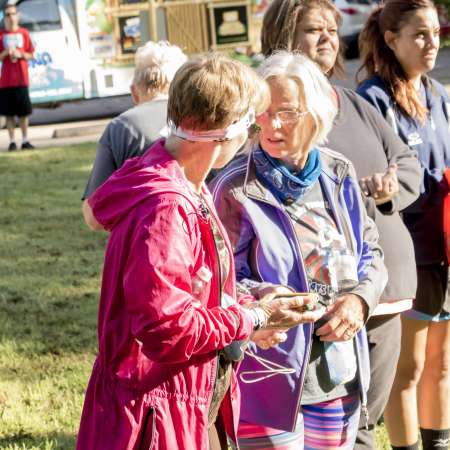 Runners listen to the awards.