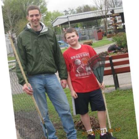 Mentor Stephen M. and Student Jacob R. help clean up Kiddie Park.