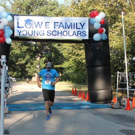 Runners cross the finish line.