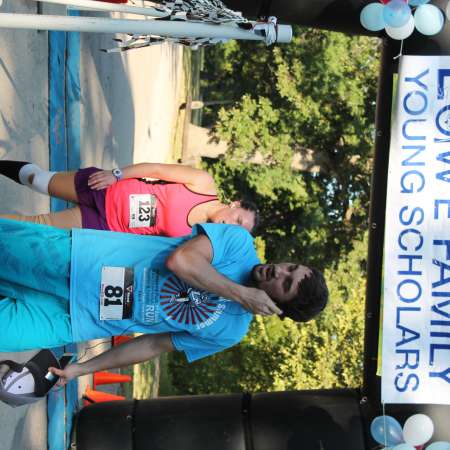 Runners cross the finish line.