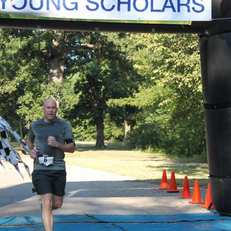 Runners cross the finish line.