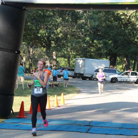 Runners cross the finish line.