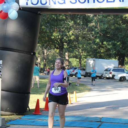 Runners cross the finish line.