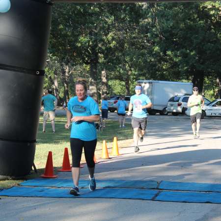 Runners cross the finish line.