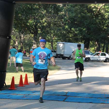 Runners cross the finish line.