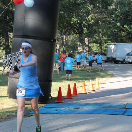 Runners cross the finish line.