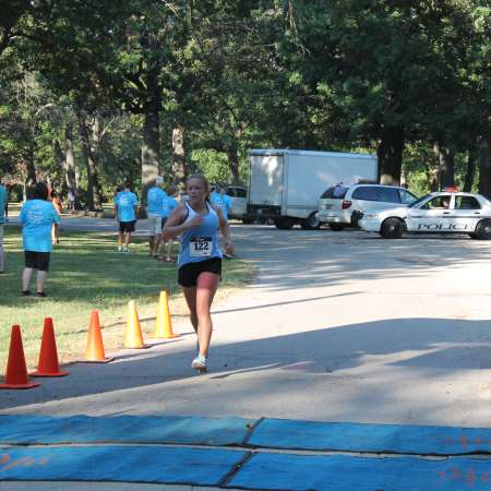 Runners cross the finish line.