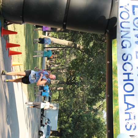 Runners cross the finish line.