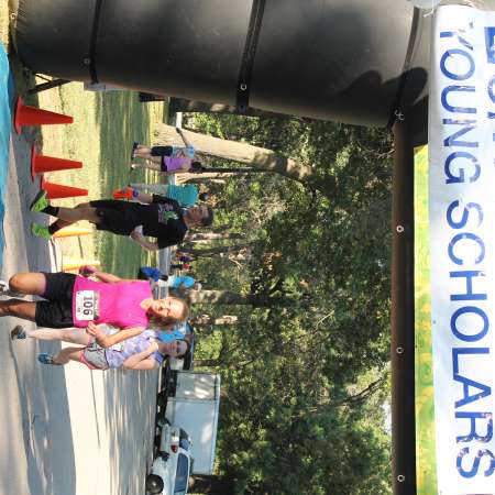 Runners cross the finish line.