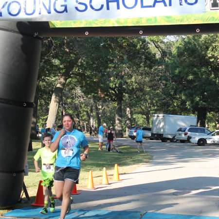 Runners cross the finish line.