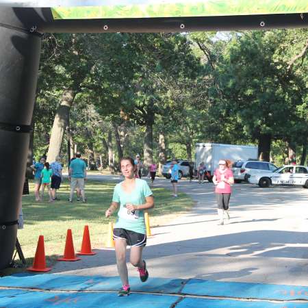 Runners cross the finish line.