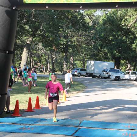 Runners cross the finish line.