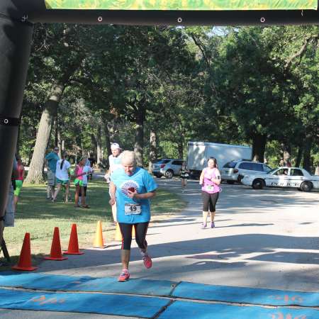 Runners cross the finish line.