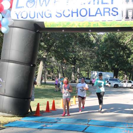 Runners cross the finish line.