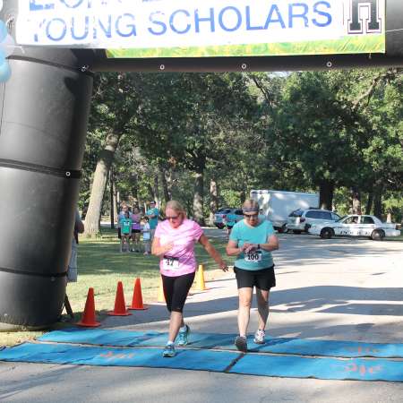 Runners cross the finish line.