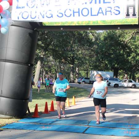 Runners cross the finish line.