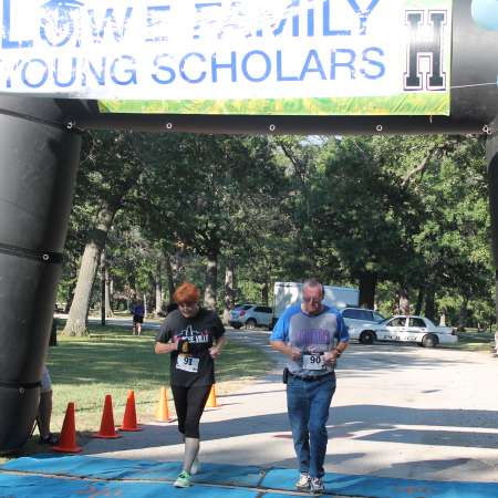 Runners cross the finish line.