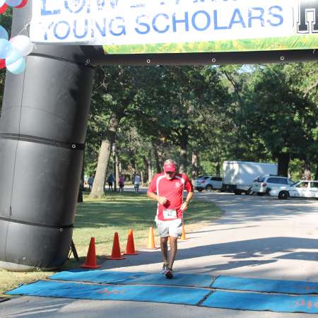 Runners cross the finish line.