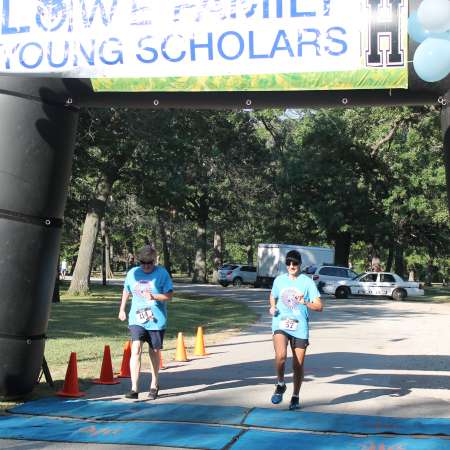 Runners cross the finish line.