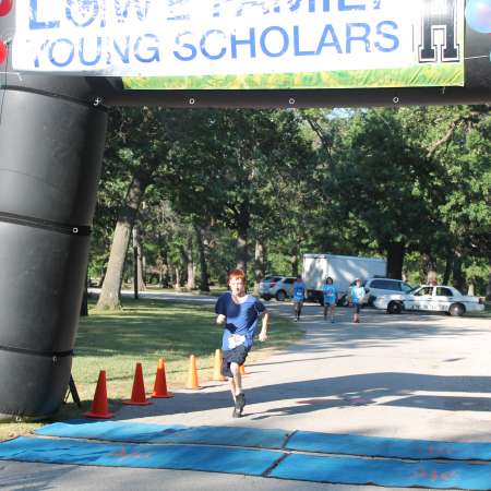 Runners cross the finish line.