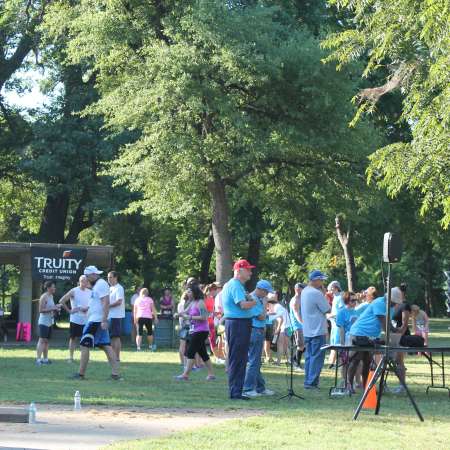 Runners listen to ending announcements.