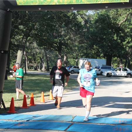 Runners cross the finish line.