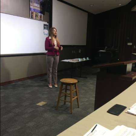 Vanessa C. tells the group about her experience in college as a new college grad.