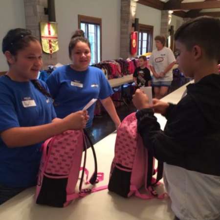 Students check backpacks to make sure they have the right supplies.