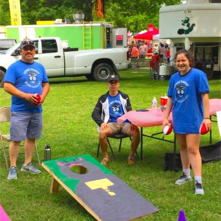 Family volunteers at SunFest.