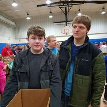 Landry and Payton help pack boxes.