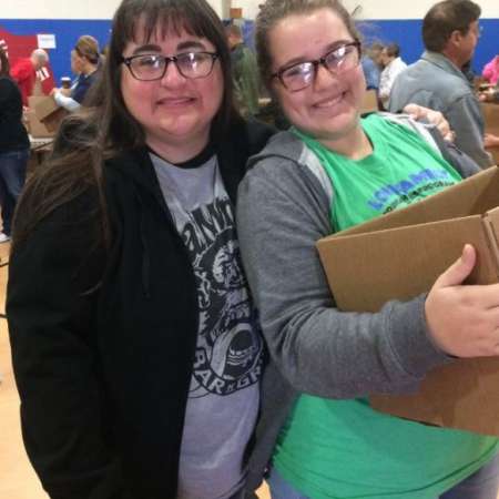 Volunteers waiting to pack their boxes.