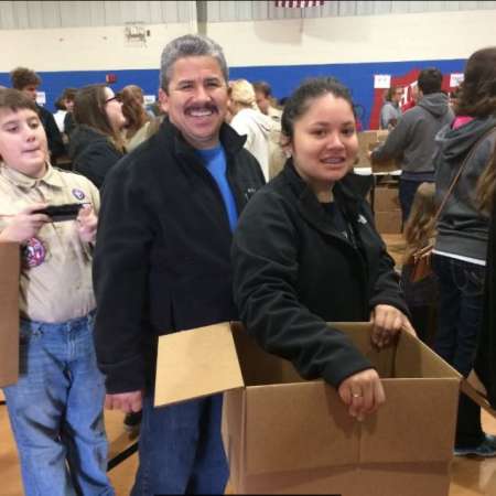 Volunteers waiting to pack their boxes.