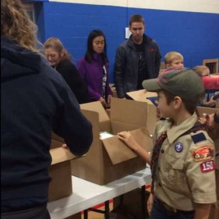 Volunteers waiting to pack their boxes.