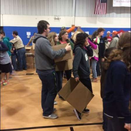 Volunteers waiting to pack their boxes.