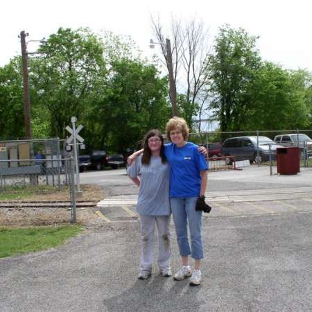 Volunteers clean up Kiddie Park to prepare it for opening weekend.