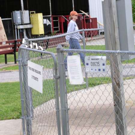 Volunteers clean up Kiddie Park to prepare it for opening weekend.